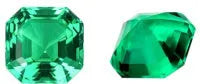 Loose cultivated emerald gemstone cabochon in Columbia green showing polished round and Asscher cut shapes.