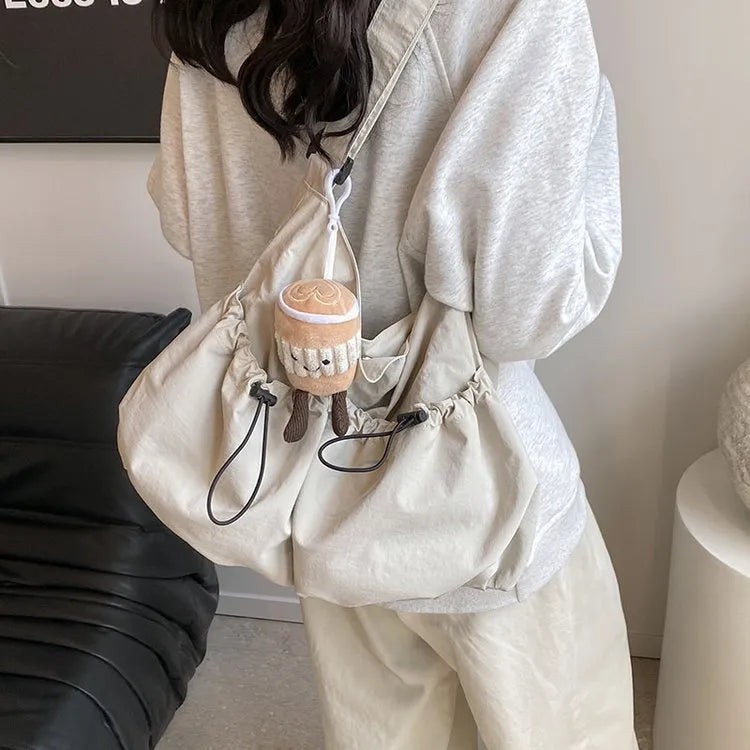 Ultra-light pleated crossbody student bag in soft polyester with split pockets
