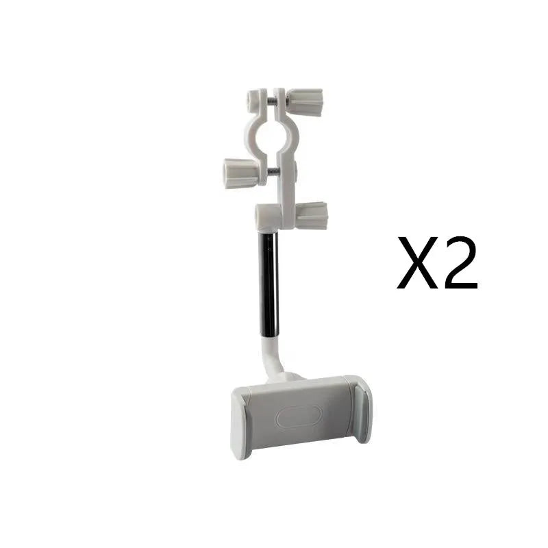 Black mobile phone bracket attached to car rearview mirror holding smartphone