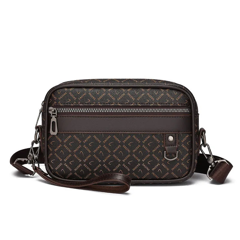 Men's black geometric pattern messenger bag showing shoulder strap and handheld carrying options