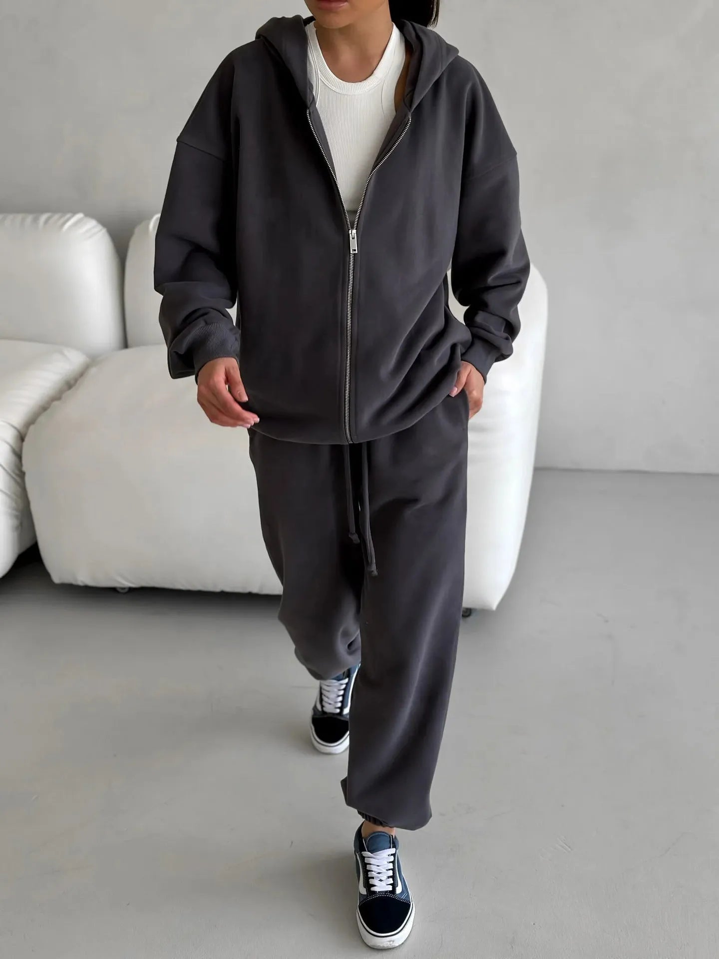 Red street style two-piece set with long-sleeved coat and trousers on clothing rack