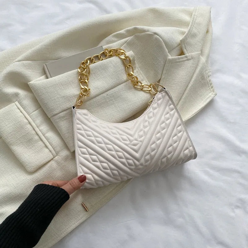 Brown pleated chain baguette shoulder bag with adjustable strap and soft carry handle