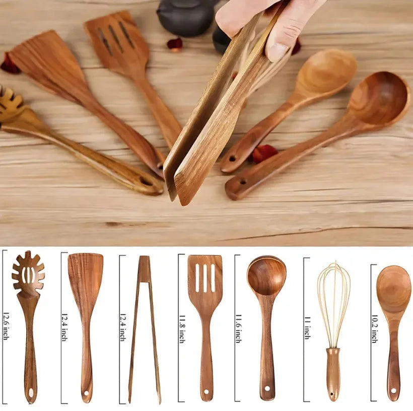Seven wooden cooking spoons and spatulas with non-slip handles arranged as a set for non-stick pans.