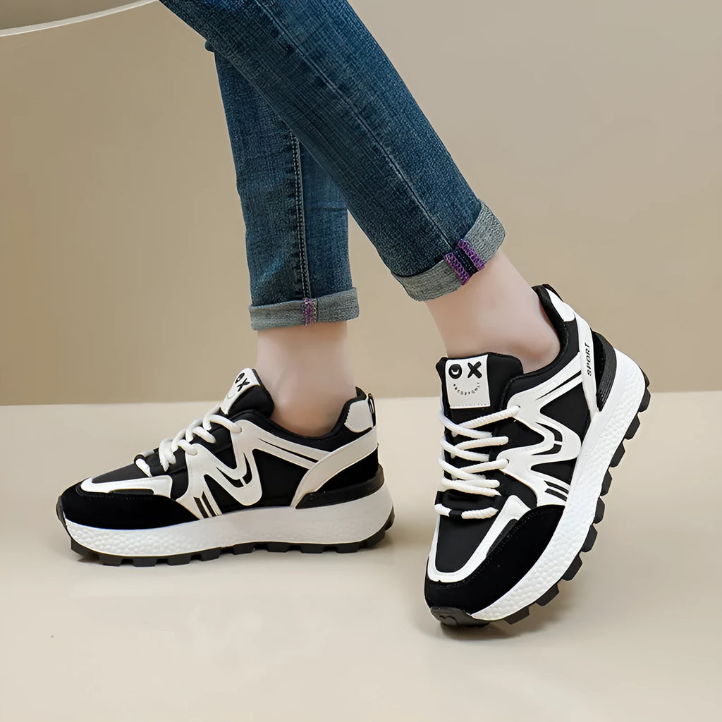 Women's flat platform casual shoes in black with lace-up front and round toe design