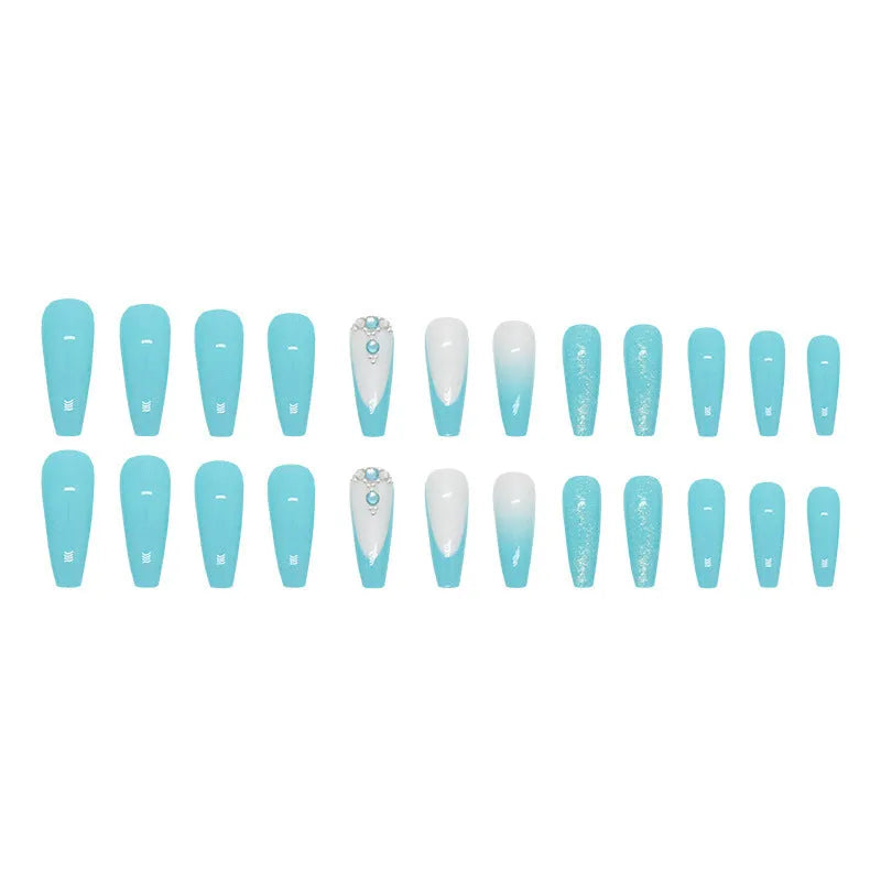 Long ballet false nails with blue diamond glitter on solid colour background with nail glue bottle