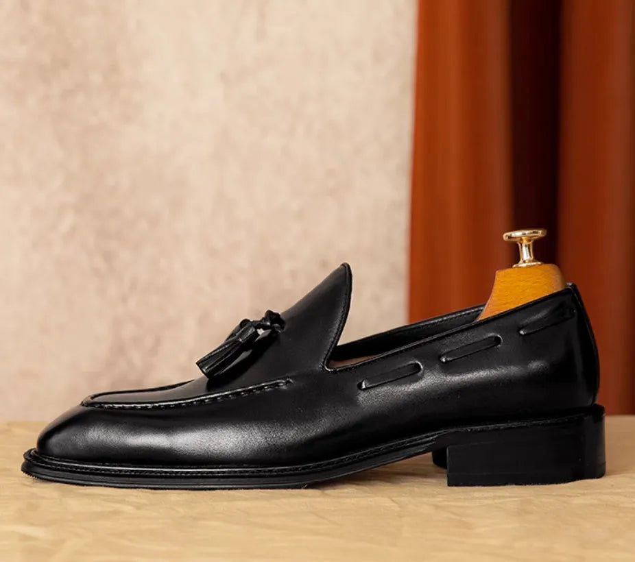 Men's black genuine leather slip-on loafers with fringed detailing and rubber sole