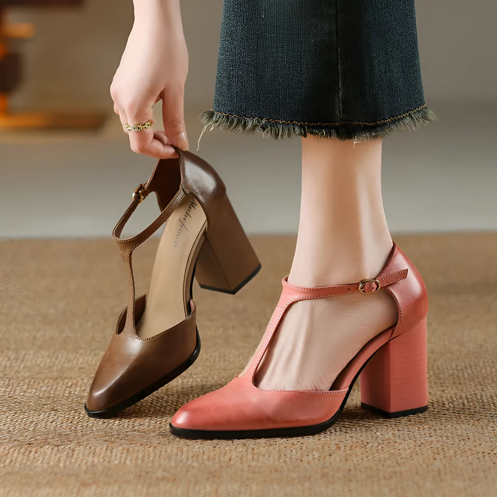 Baotou hollow-cut retro Mary Jane shoes in dark brown with pointed toe and buckle fastening.