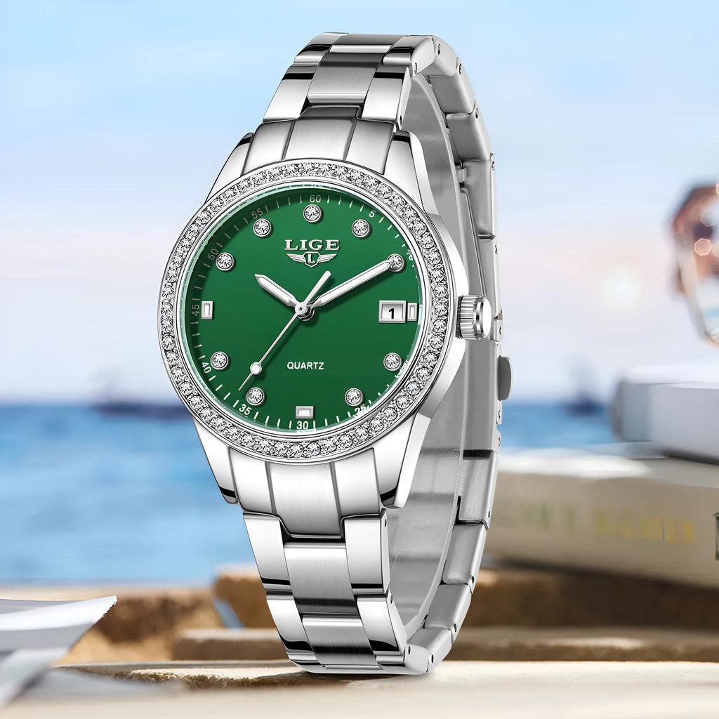 Women's silver quartz watch with diamond-encrusted bezel and luminous dial on stainless steel strap