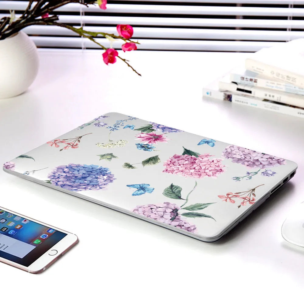 Hard plastic laptop protective shell with a partial floral print design for MacBook Air and Pro models.