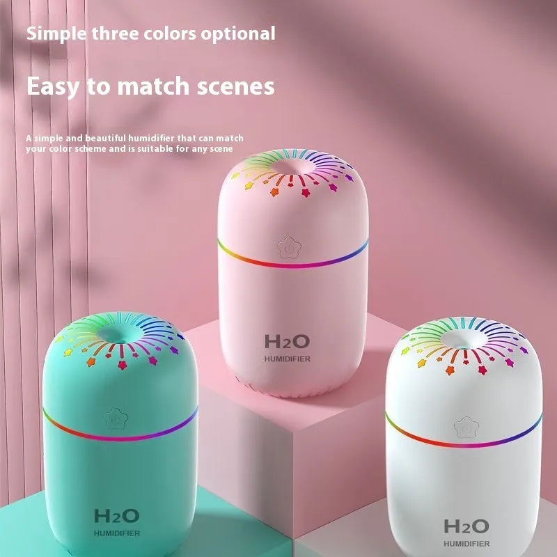 USB mini humidifier with fireworks design in white, pink, or green colours showing compact 75mm size