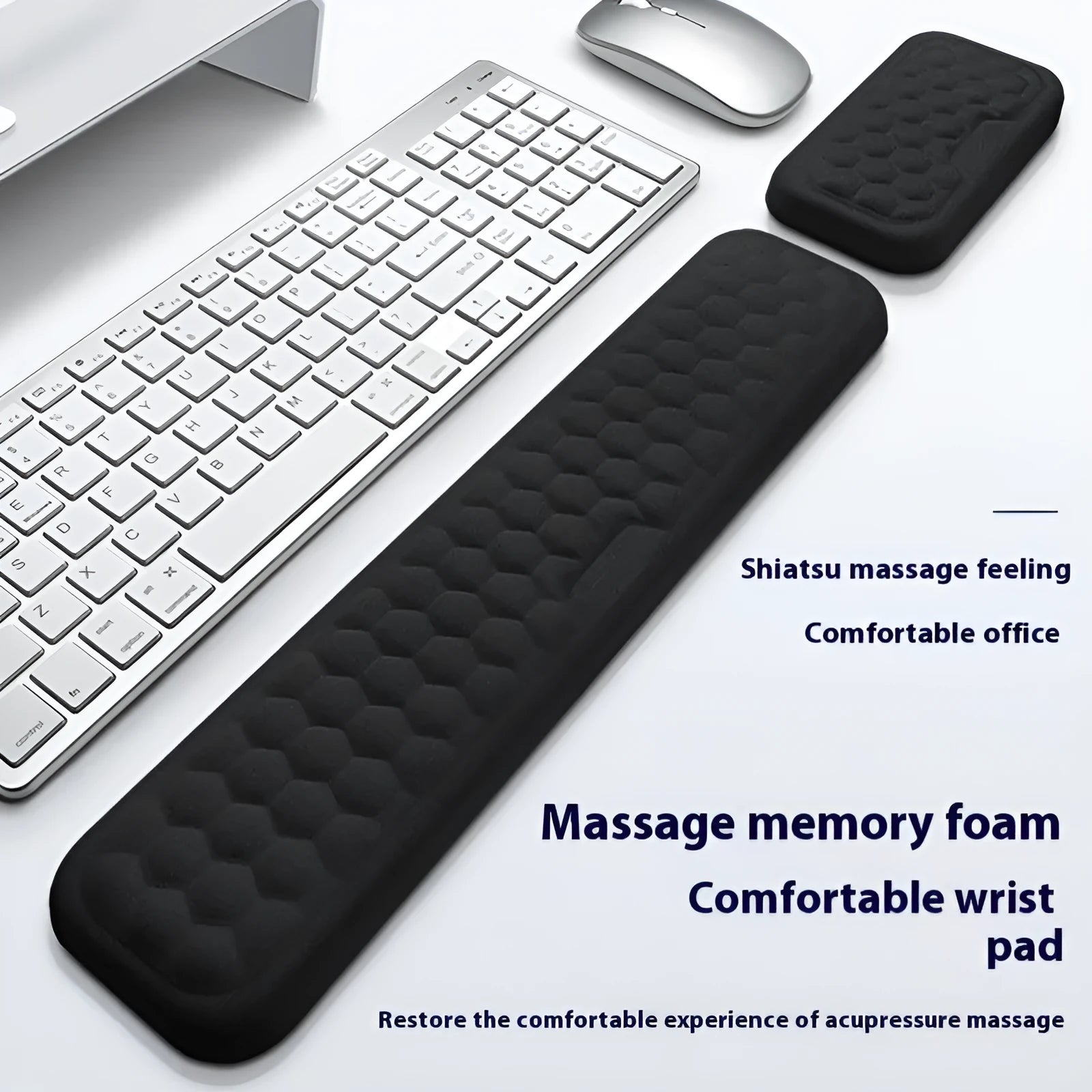 Memory foam mouse wrist pad with silicone bottom in black cloth cover on computer desk
