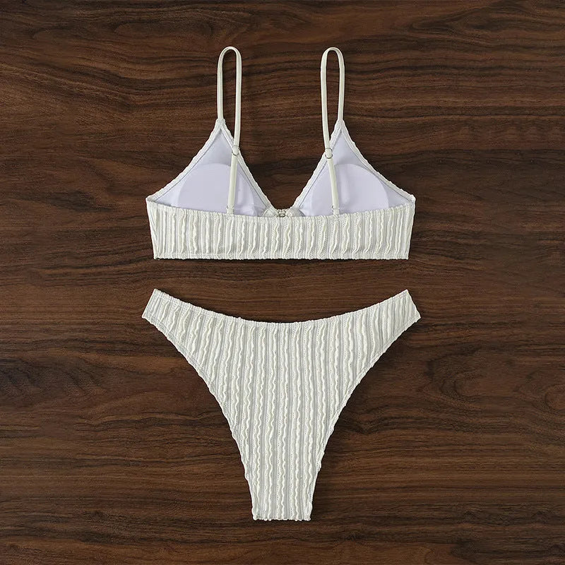 White women's V-neck split swimsuit with sleeveless design and matching shorts