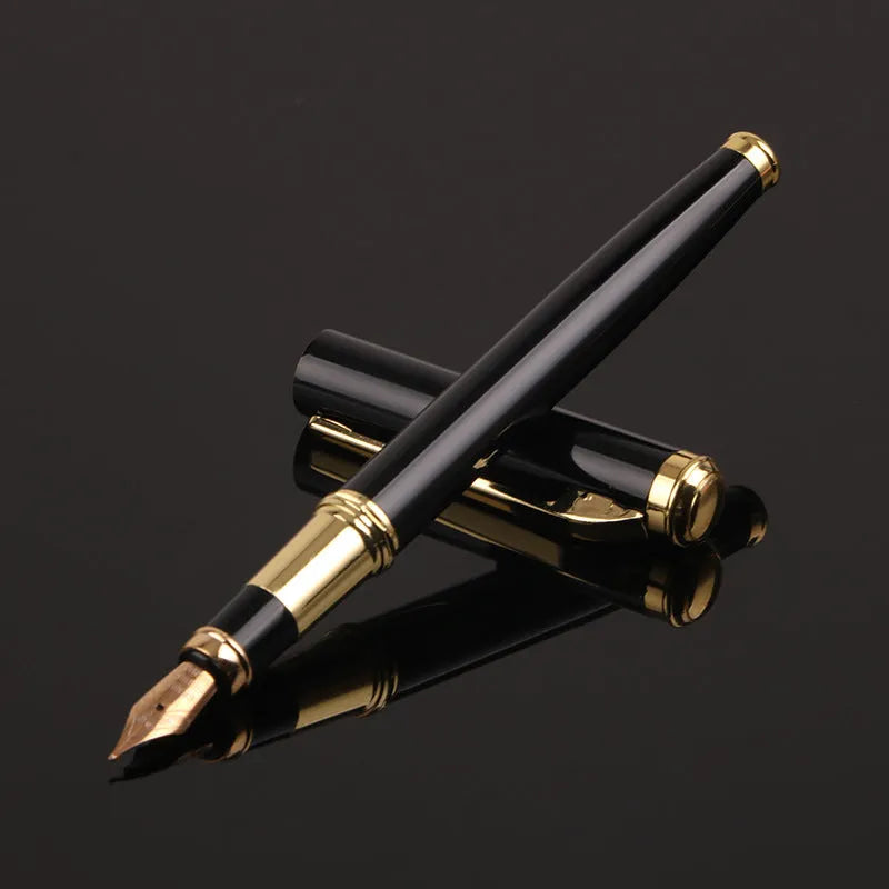 Red and black metal fountain pen with a 0.5mm Yijin nib on a writing surface.