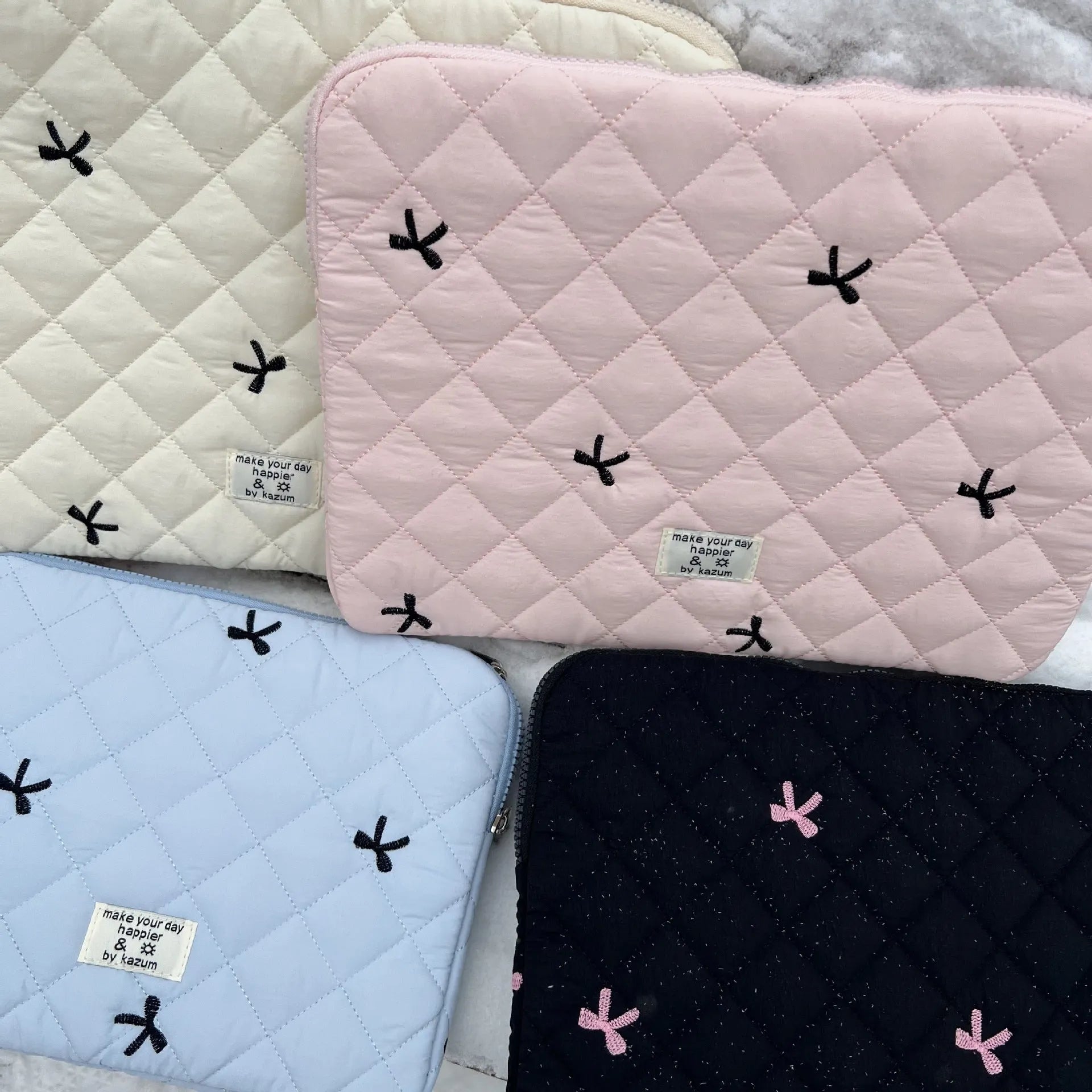 Rhombus embroidered bow laptop storage bag in nylon material with size options for 11-inch to 15.6-inch devices