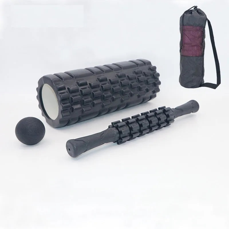 Black fitness foam roller massage bar measuring 33cm long on a plain background.