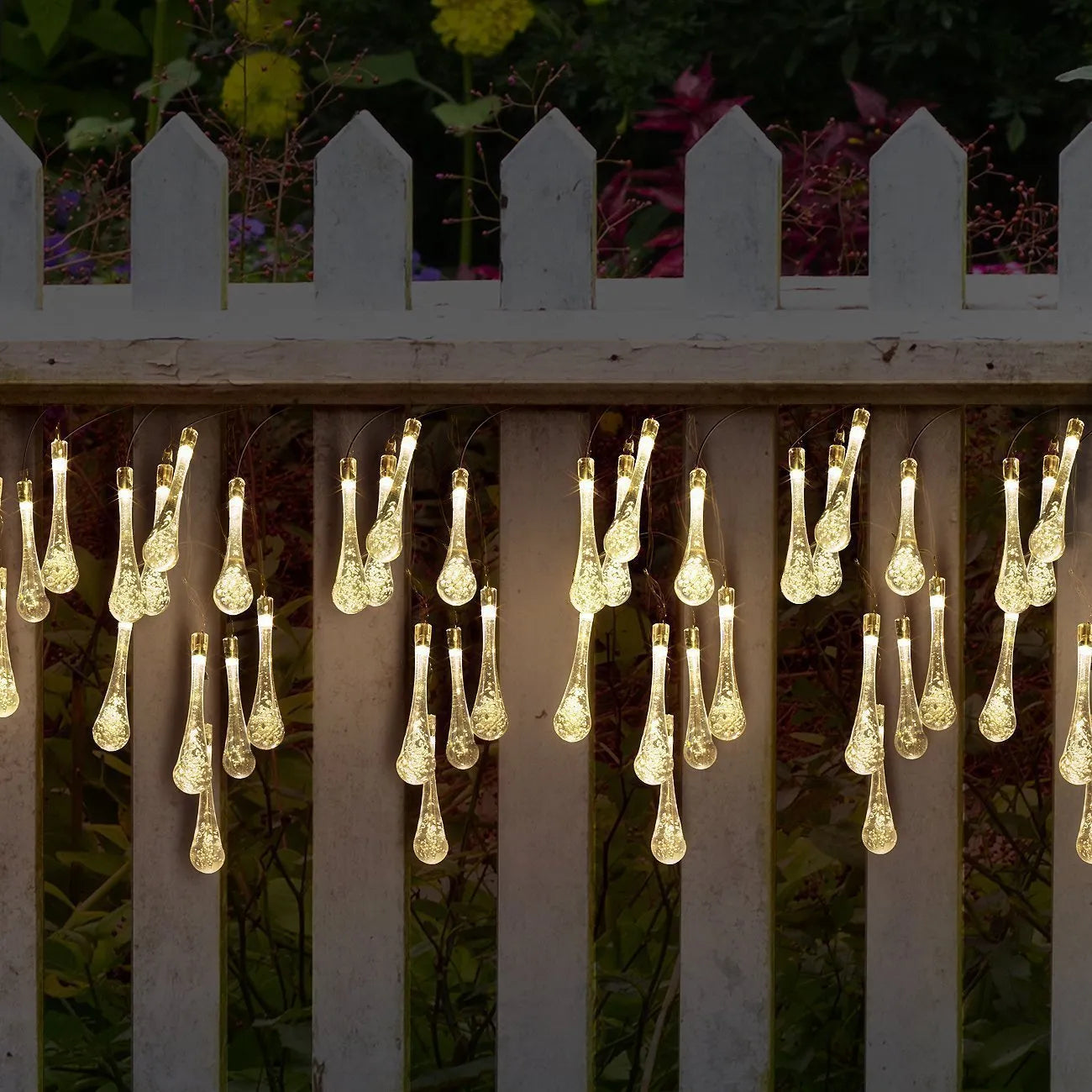 Solar-powered LED garden string lights with water drop shaped ABS pendants on a 6.5 metre wire.