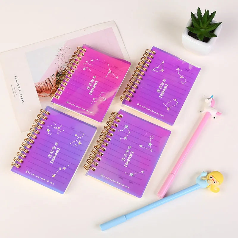 Four A7 spiral-bound pocket notebooks showing different PP cover designs: Constellation, Sakura, Universe, and Ocean.