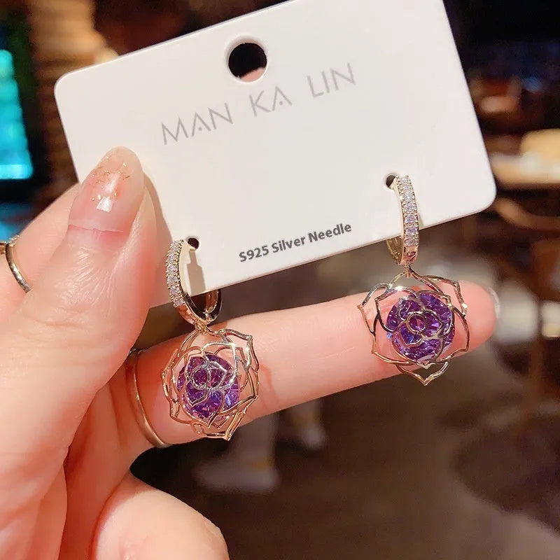 Geometric rose design copper earrings with zircon stones in an electroplated colour finish.
