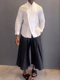 White asymmetric long sleeve shirt and black pleated trousers casual outfit set