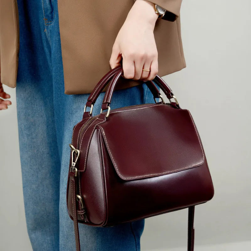 Women's genuine leather crossbody tote bag in apricot colour showing outer slit pocket and double shoulder straps