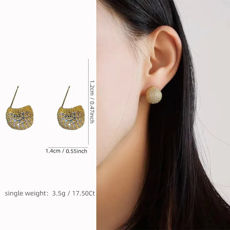 Gold and white geometric drop earrings with little golden beans design and ear clip fastening