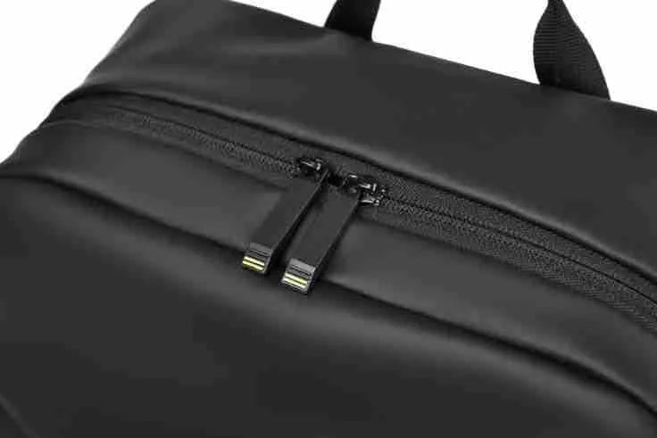 Large waterproof backpack in PU leather with sewing thread detailing and computer bag