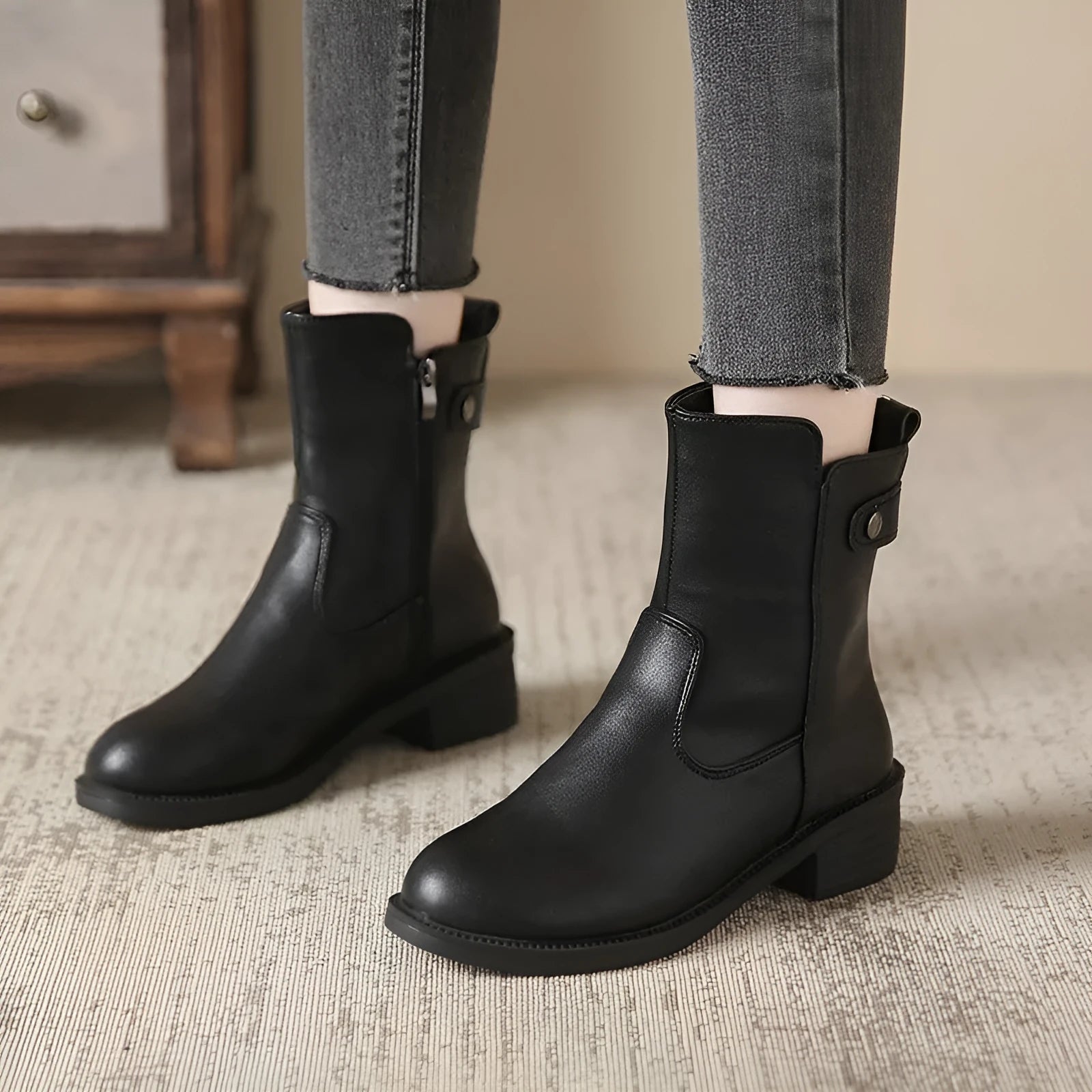 Women's black low heel ankle boots with side zip and round toe design