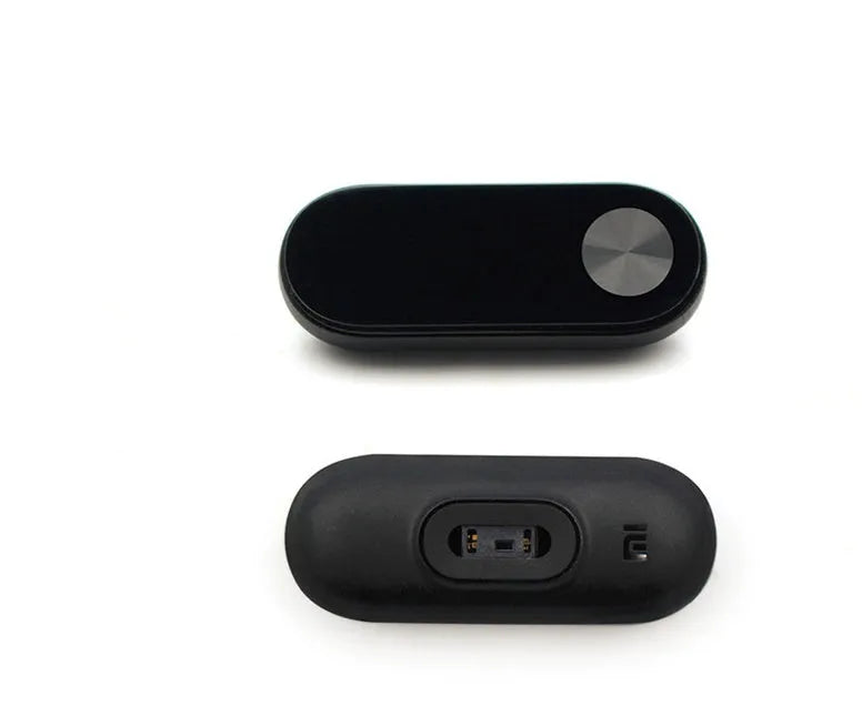 Xiaomi Mi Band 2 black fitness tracker on wrist showing OLED touchscreen display