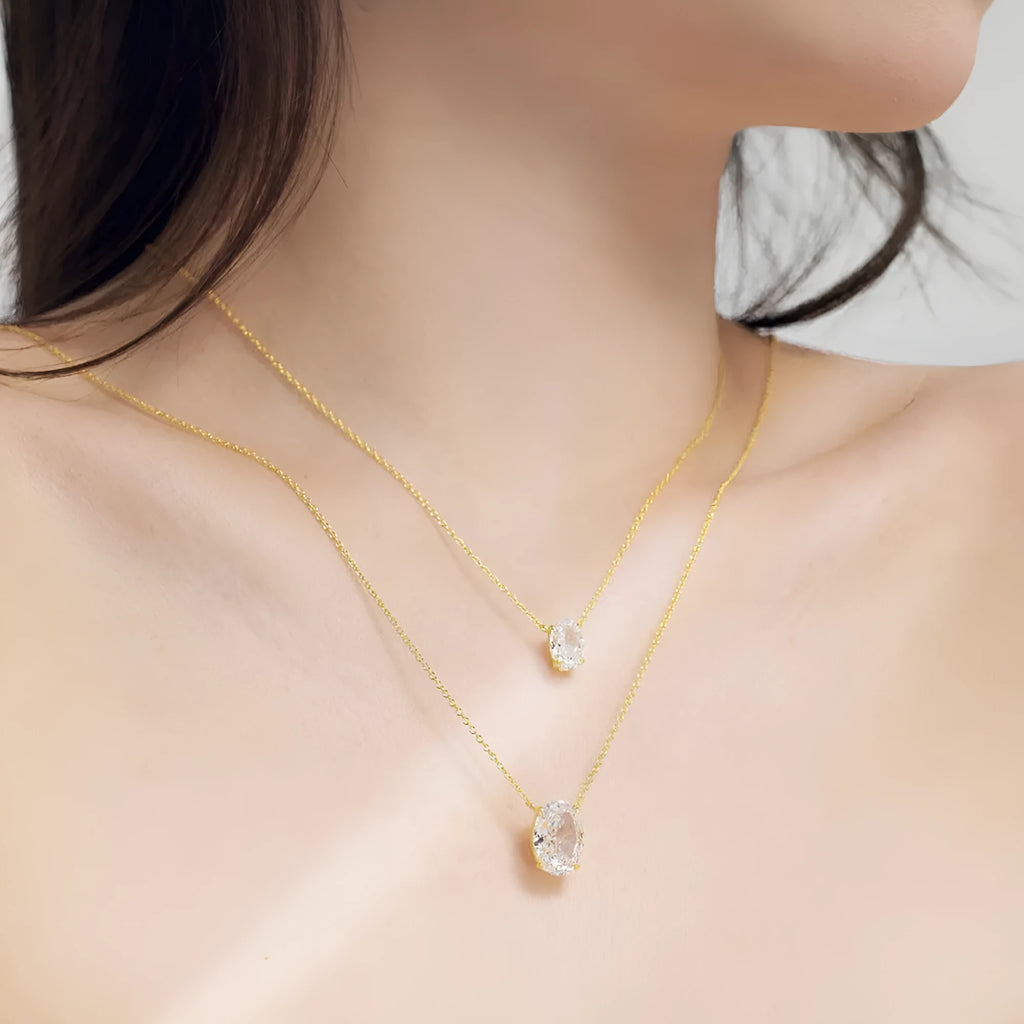 Oval ice flower geometric pendant necklace in sterling silver with platinum or gold electroplated finish.