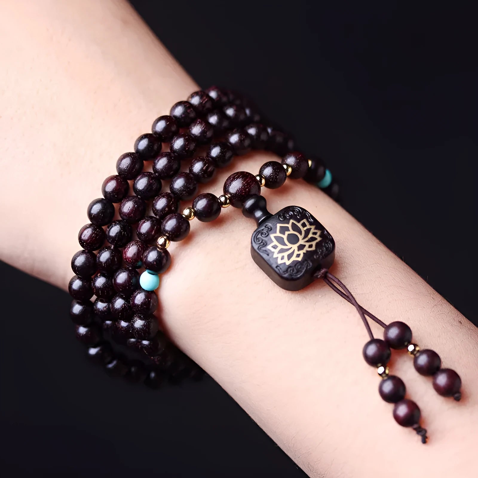 Zambia rosewood bead bracelet with flat lotus pendant showing 108 wooden beads