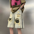 Men's ripped yellow mud camouflage denim shorts with a straight leg Korean style cut.