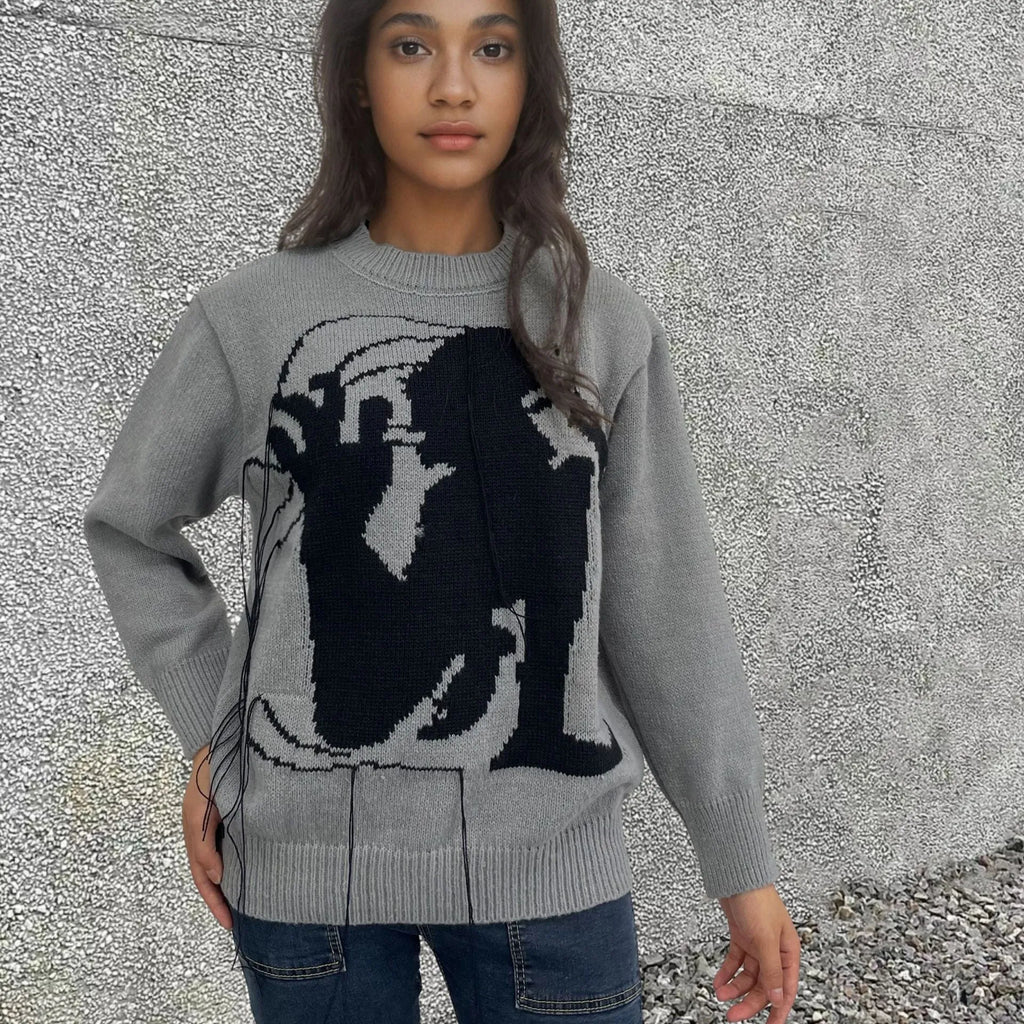 Women's loose alpaca wool sweater with abstract pattern and tassel detailing in street fashion style
