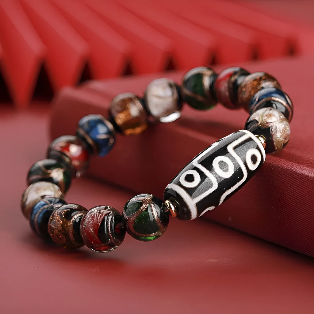 Close-up of a colourful Chinese snake year lucky bead bracelet made from hand-strung coloured glaze.