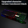White or black gaming keyboard with glowing LED backlight and USB cable on a desk