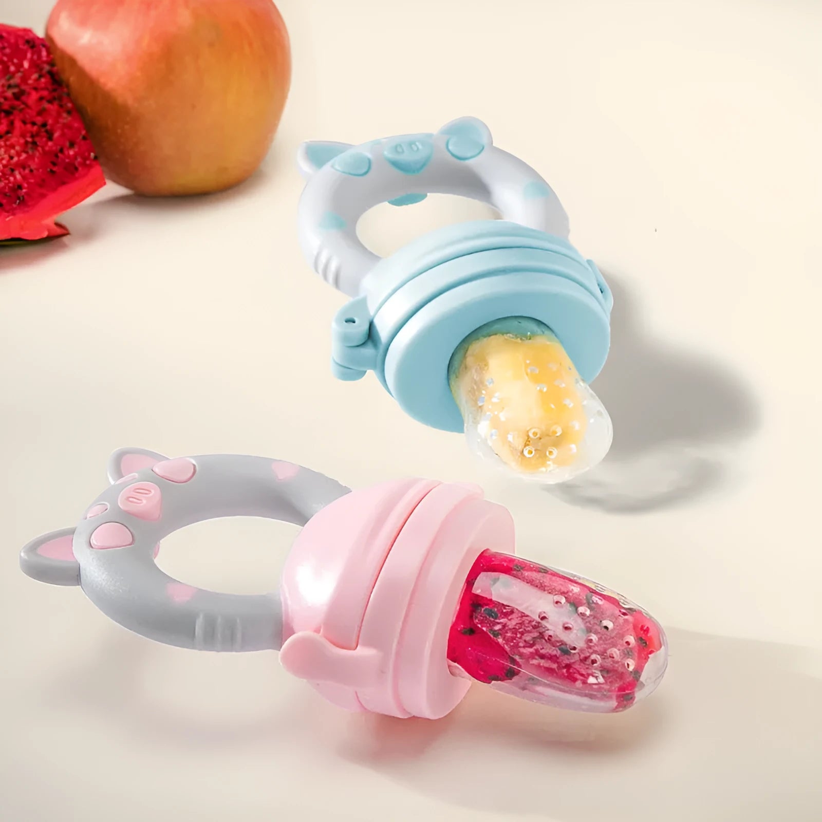Silicone baby teether in blue, green, or pink with textured mouthpiece for infant gum relief