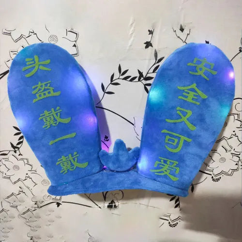 Rabbit Glow Ears helmet decoration with locomotive and ski designs on a Velcro base
