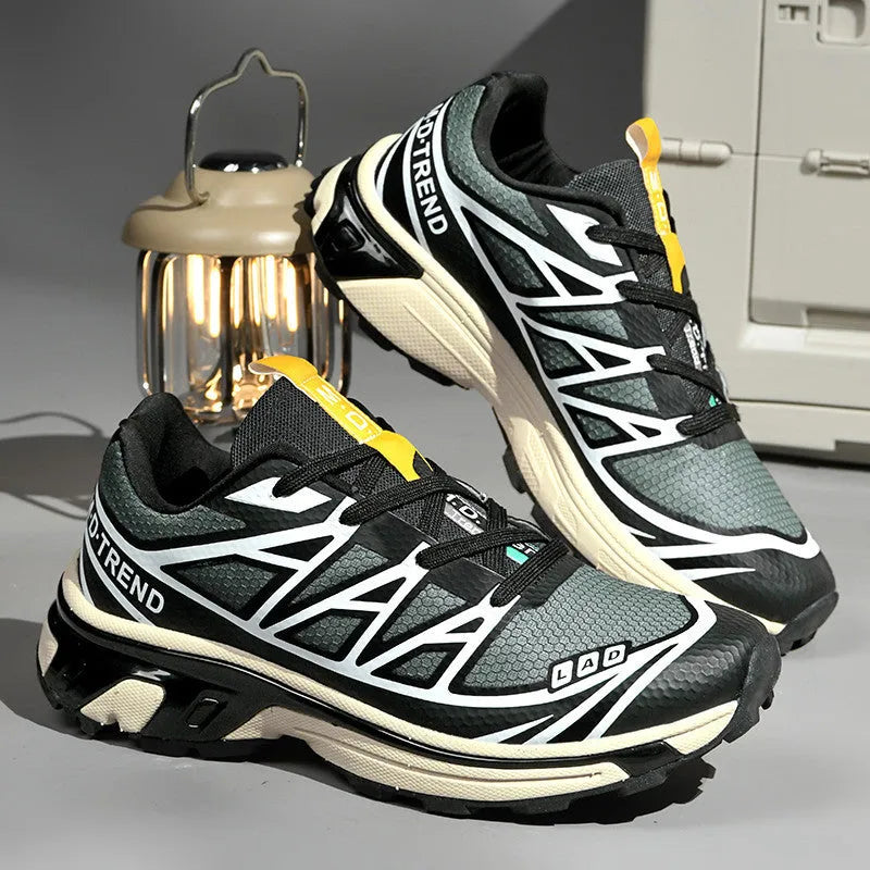 Men's and women's low-top hiking shoes in khaki colour with round toe and lace-up front.