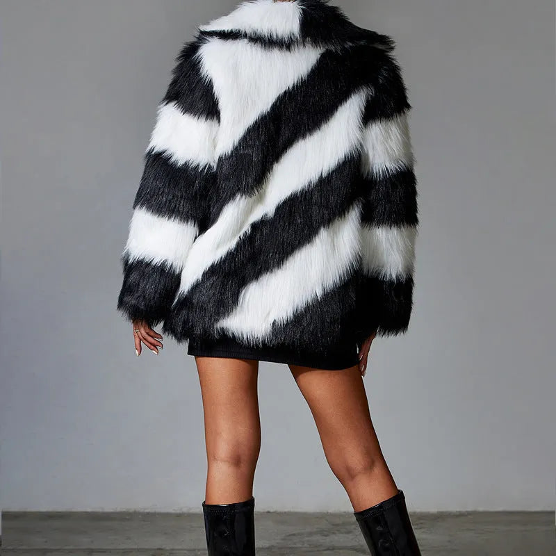 Picture Colour faux fur coat with dark contrast lapels and a matching fur collar.