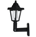 Black hexagonal solar-powered outdoor wall lamp with integrated solar panel