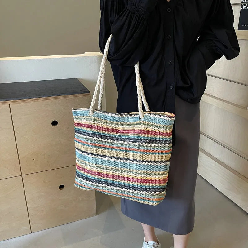 Blue straw woven shoulder bag with nylon construction and polyester lining