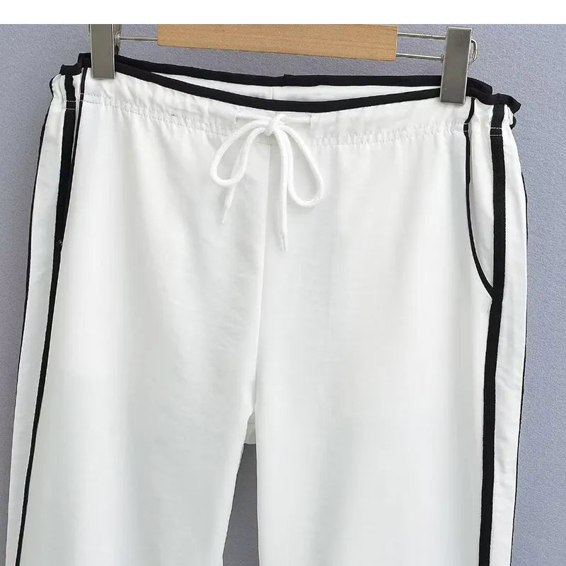 Women's navy blue loose straight leg trousers with white ribbon contrast pattern detail