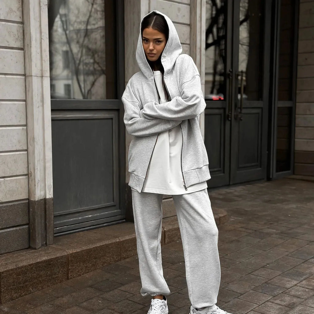 Red street style two-piece set with long-sleeved coat and trousers on clothing rack