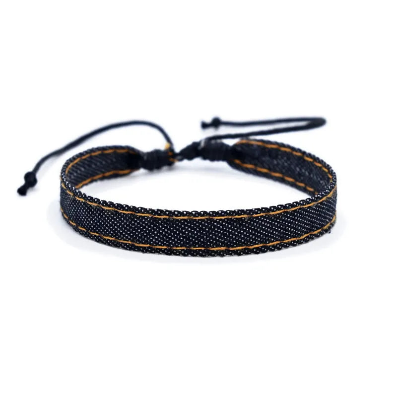 Denim fabric bracelet carrying strap with mixed materials and unisex design