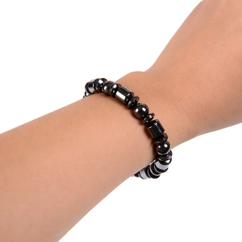 Black magnetic therapy bracelet with a pentagram stone design made from magnetite and hematite.