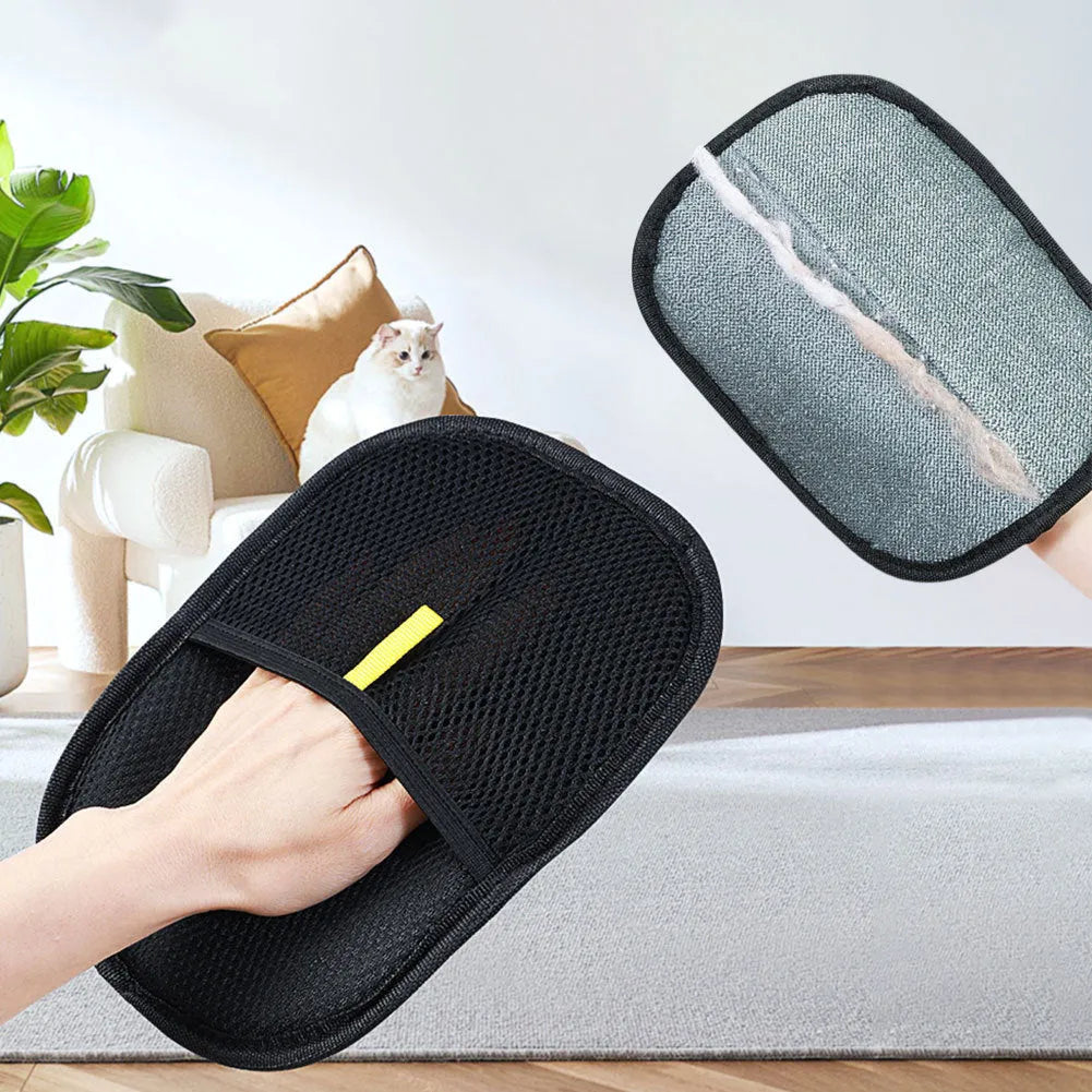 Black pet deshedding glove with silicone bristles for grooming dogs, cats, and rabbits.