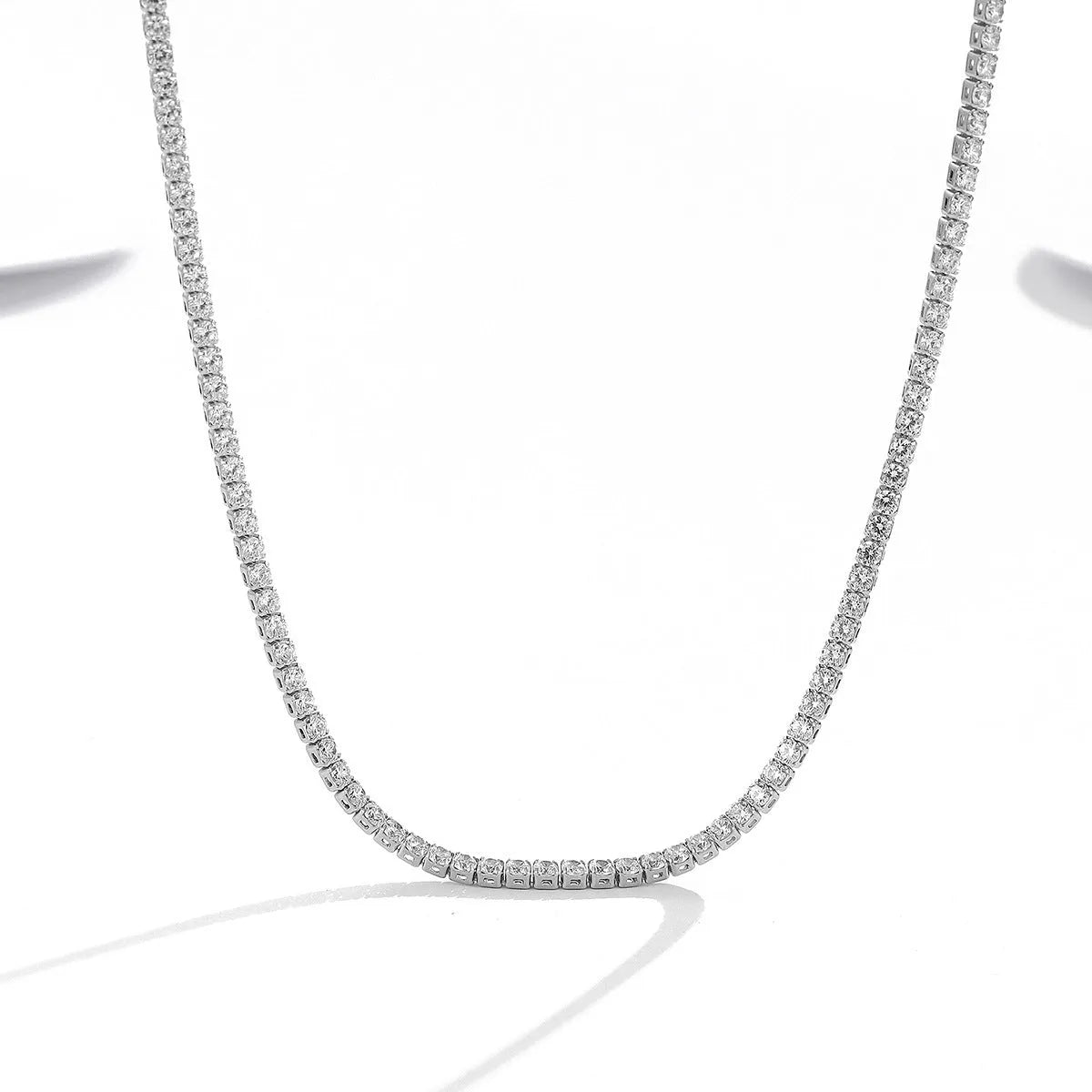 Women's sterling silver necklace with round pendant and diamond-like treatment