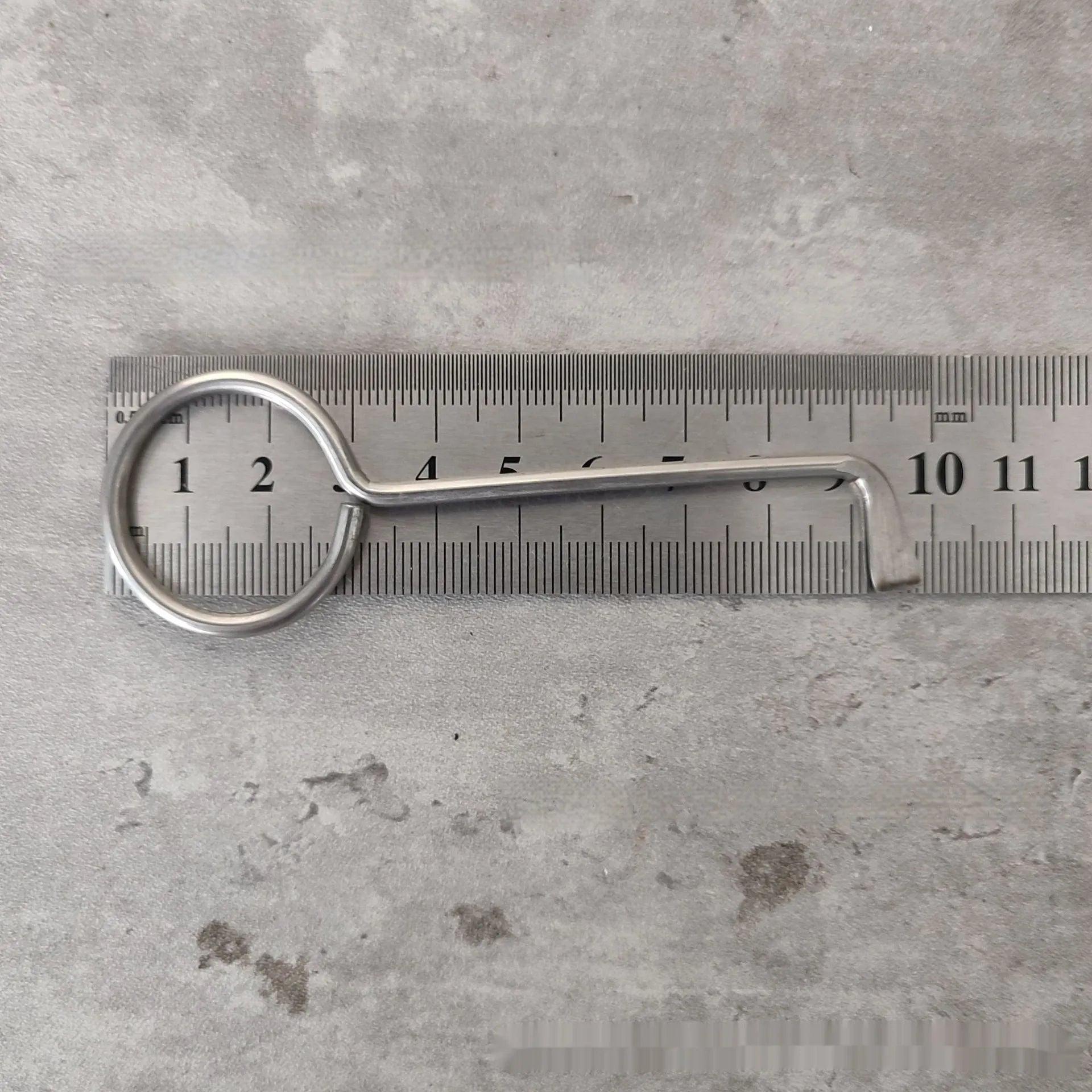 Two alloy wrench tools from a portable family maintenance set on a plain background.