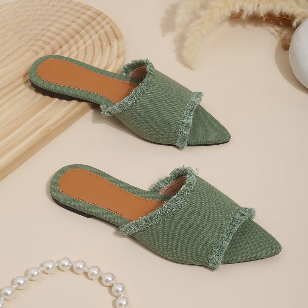 Women's denim flat slippers with tassel detail and leather lining in apricot colour.