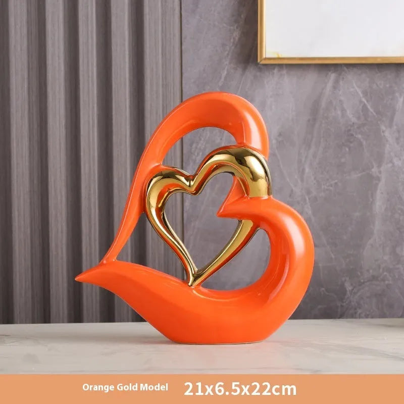Modern white porcelain love heart ornament with a choice of metallic gold, silver and coloured finishes.
