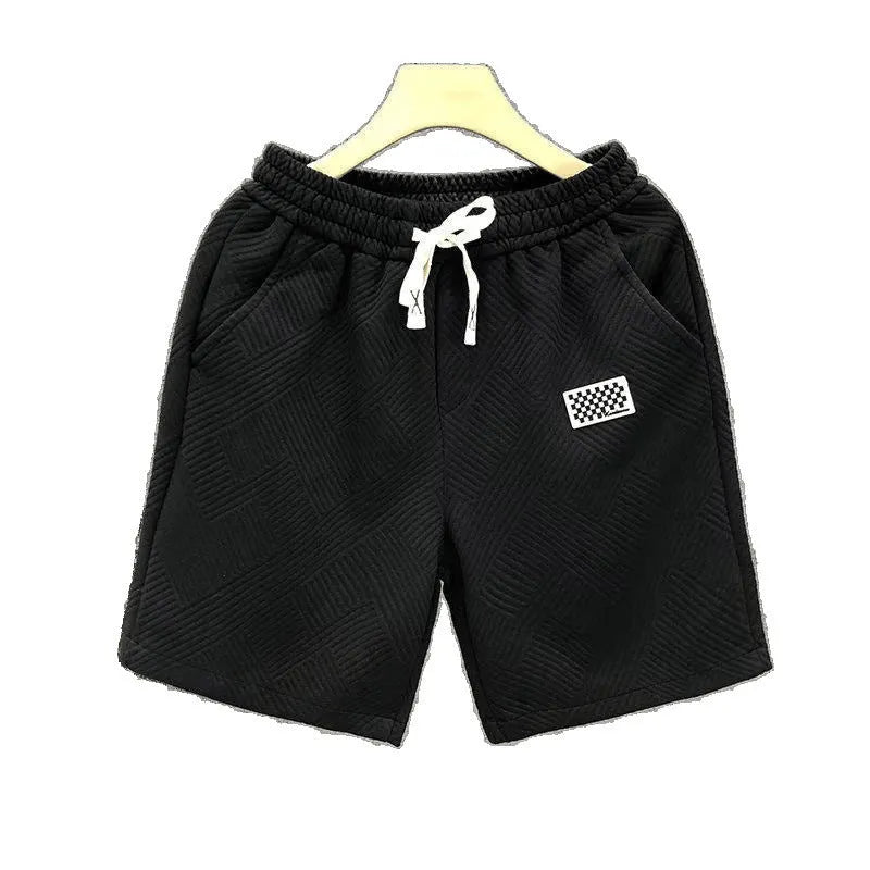 Men's solid colour polyester sports shorts with elastic waist in white, black and green options